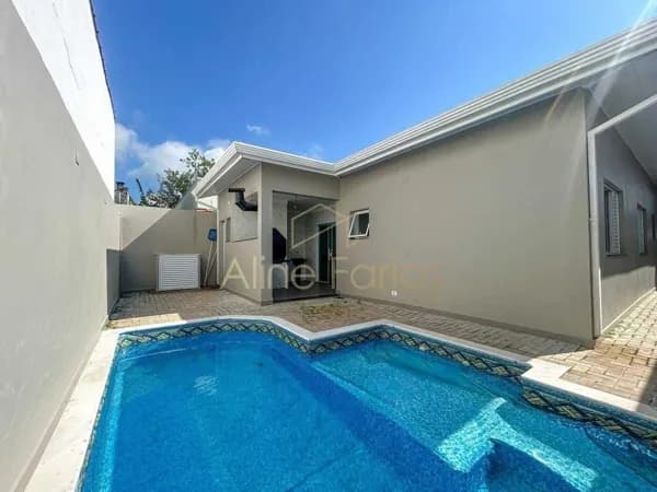 Casa com 3 suítes, arquitetura moderna e ambientes integrados à venda em Peruíbe