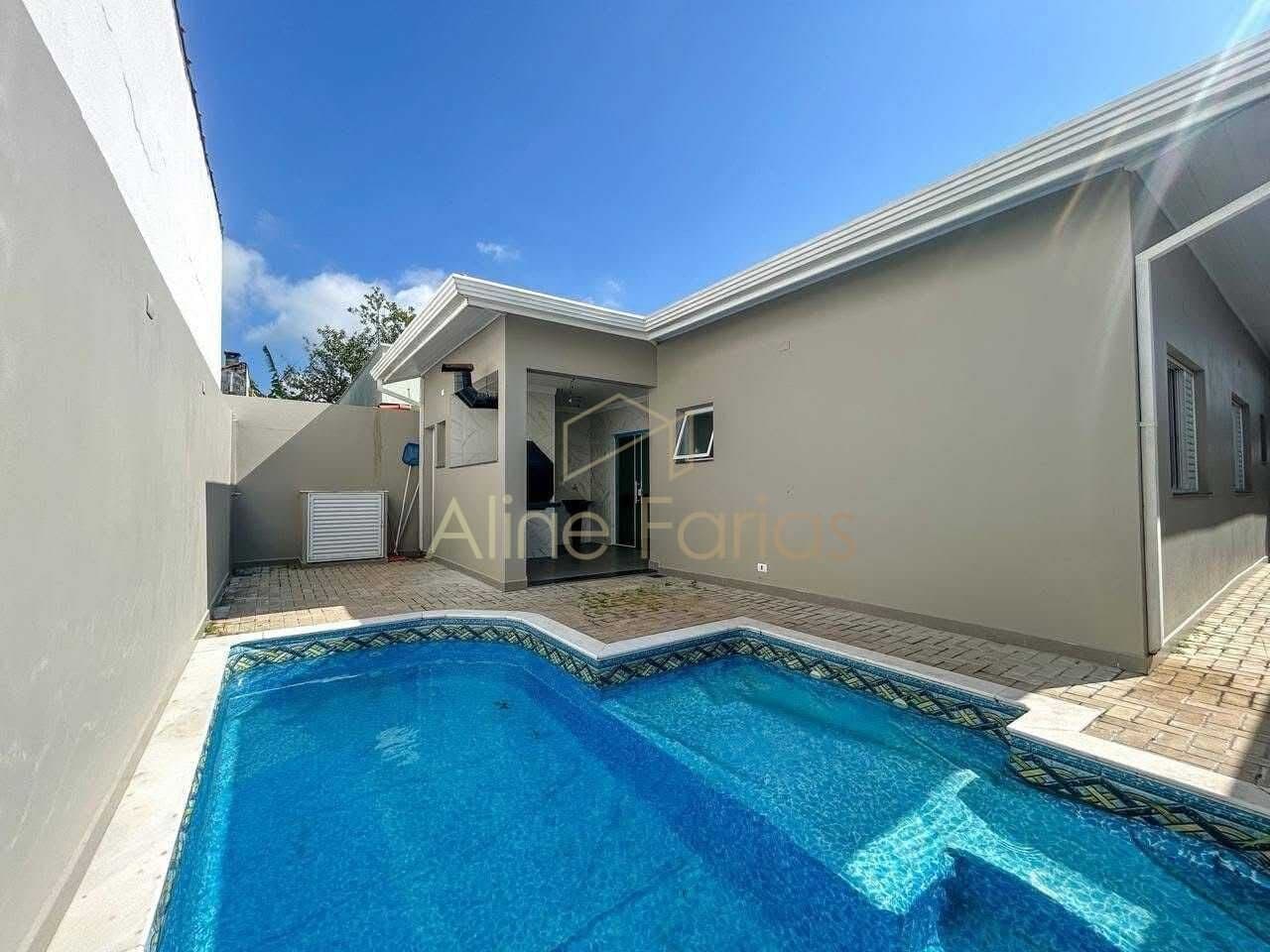 Casa com 3 suítes, arquitetura moderna e ambientes integrados à venda em Peruíbe