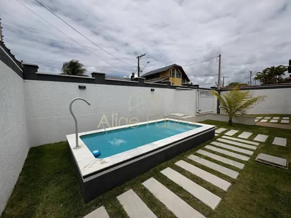 Casa nova e moderna com piscina, área gourmet integrada e excelente padrão à venda em Peruíbe