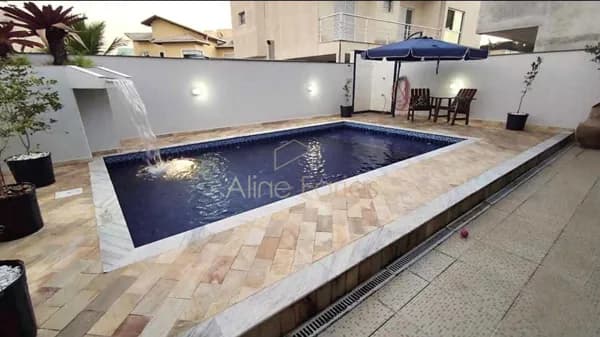 Sobrado em condomínio com piscina, espaço gourmet completo e suíte master com sacada à venda em Peruíbe