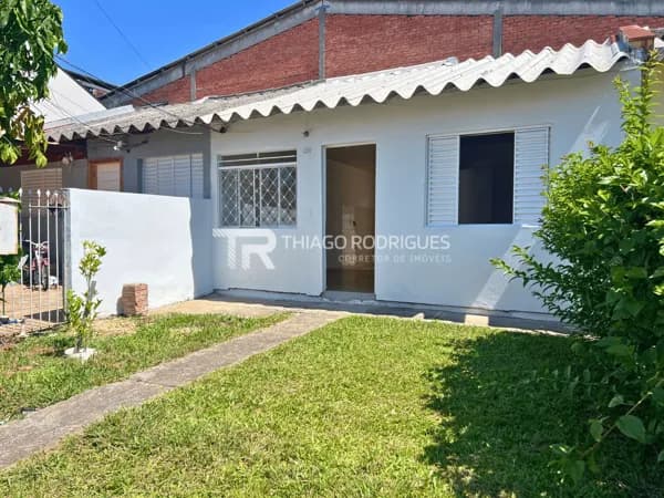 Casa à venda em condomínio fechado no bairro Igara em Canoas com vaga para 2 carros