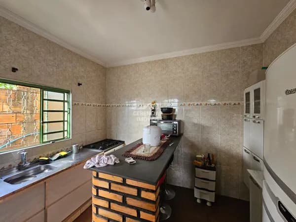 Casa com quintal e garagem a venda em Igarapé MG