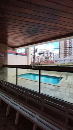 Apartamento com sacada em predio com piscina , Caiçara - Praia Grande/SP