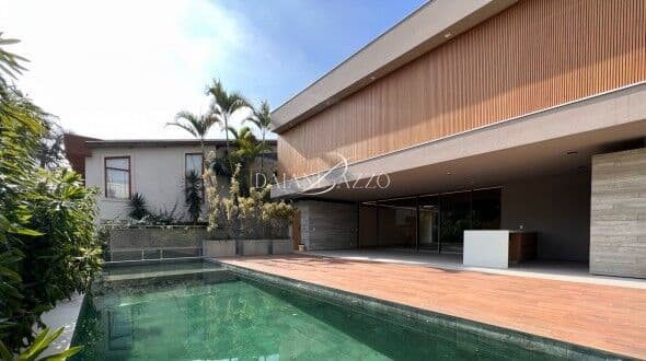 Casa contemporânea à venda no Alphaville 1 assinada por Rodrigo Latorre com 4 suítes e área gourmet