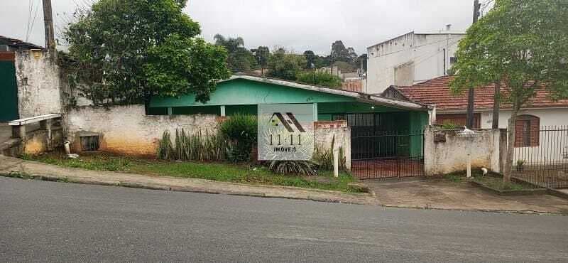 Terreno à venda no bairro Santa Cândida com duas casas