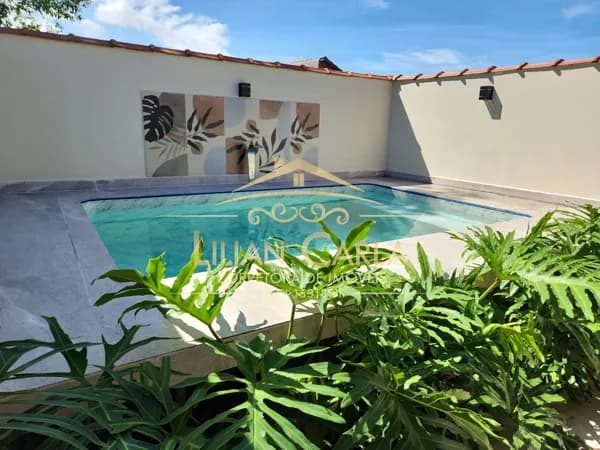 Casa à venda em Mongagua com 2 dorm, 1 suíte e Piscina por R$ 390 mil