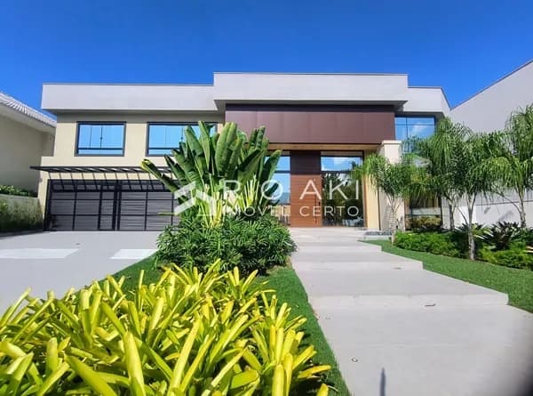 Mansão luxuosa, semimobiliada, 5 suítes, 1096m², fino acabamento, lazer moderno e elevador.
