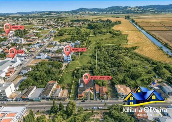 Terreno com mais de 5 hectares, com 2 salas comerciais e apartamentos, com acesso á 5 ruas