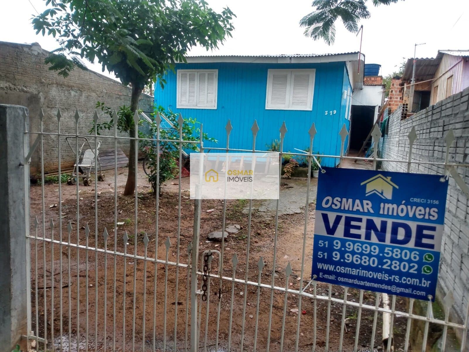 Casa de madeira com 3 dormitórios no bairro Auxiliadora, Gravataí/RS.