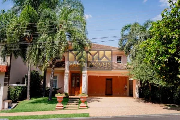 Casa Neoclássica | 4 Suítes, Lazer e Paisagismo Exuberante no Condomínio Paineiras