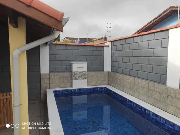 Casa á venda com piscina e churrasqueira no bairro Nova Itanhaém em Itanhaém/SP