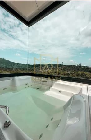 Casa de Alto Padrão no Condomínio Gênesis 2 Alphaville – 604m², 4 Suítes, Piscina e Vista para a Mata
