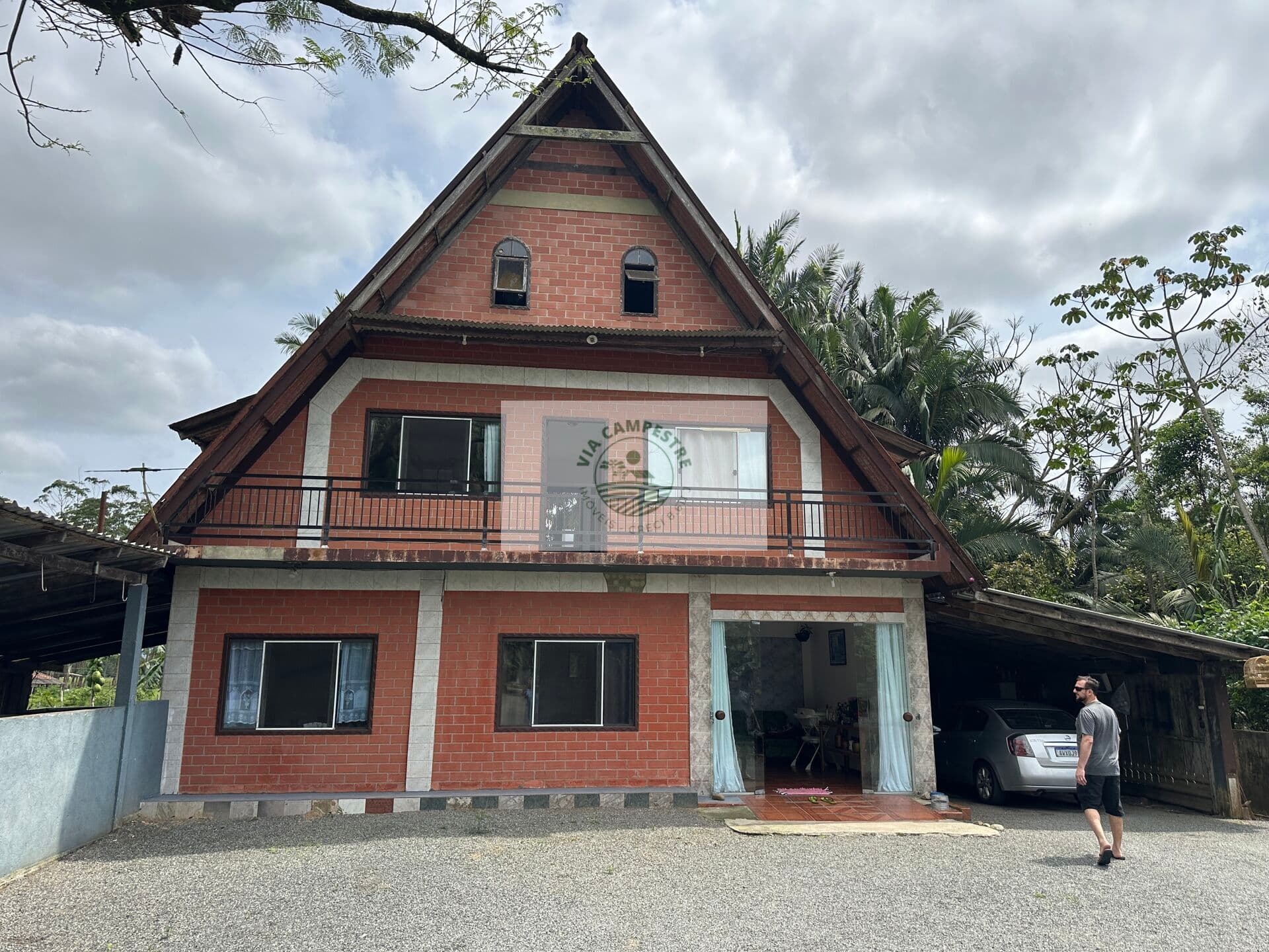 Terreno com 9.292 m2, de frente para o asfalto, Estrada Timbé, com 2 casas, galpão, rancho
