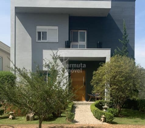 Casa com 465m², 4 suítes, 3 vagas de garagem, piscina e sala de ginástica no Gênesis I