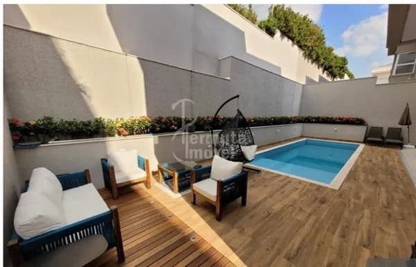 Casa moderna com 4 suítes, piscina climatizada
