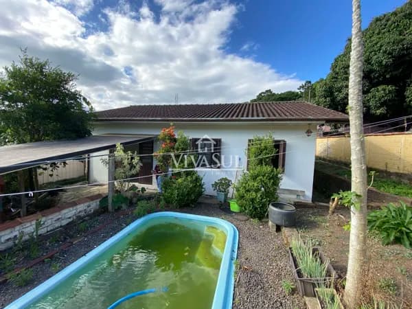 Duas Casas pelo Preço de Uma – Excelente Oportunidade para Morar e Investir!