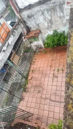 Terreno com casa antiga no quintal