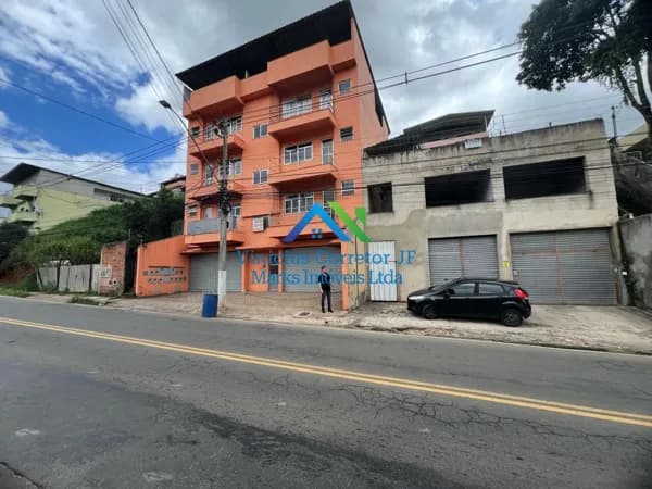 Apartamentos com 3 andares em construção e 1 loja.