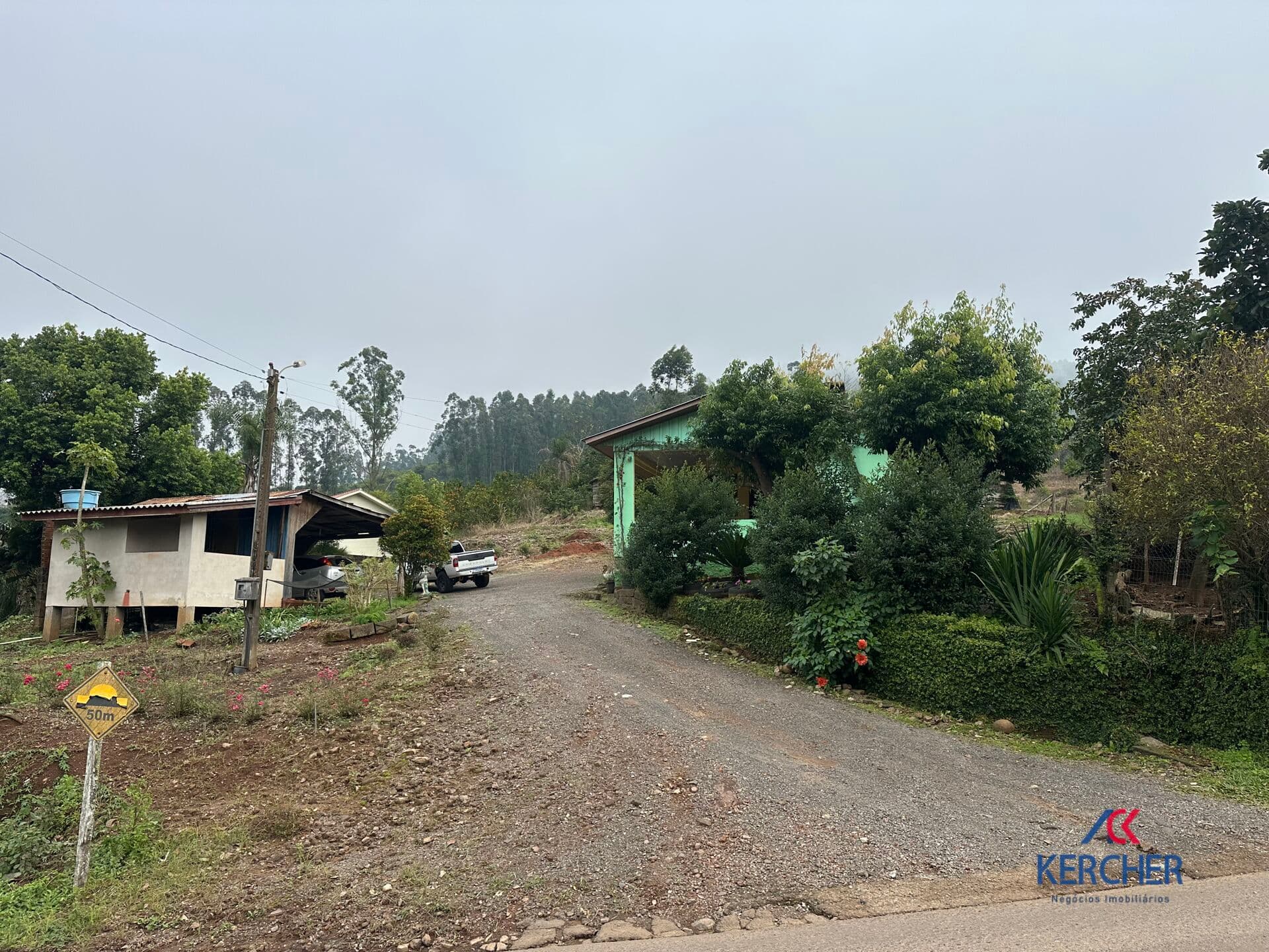 Área de terras com casa em Tupandi