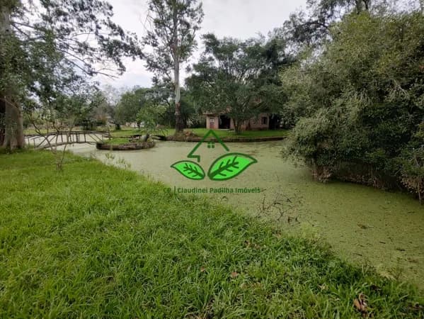 Vende: Maravilhoso sítio com casa rústica, piscina e açude a 200 m da RS-020 na parada 97 em Morungava, Gravataí/RS